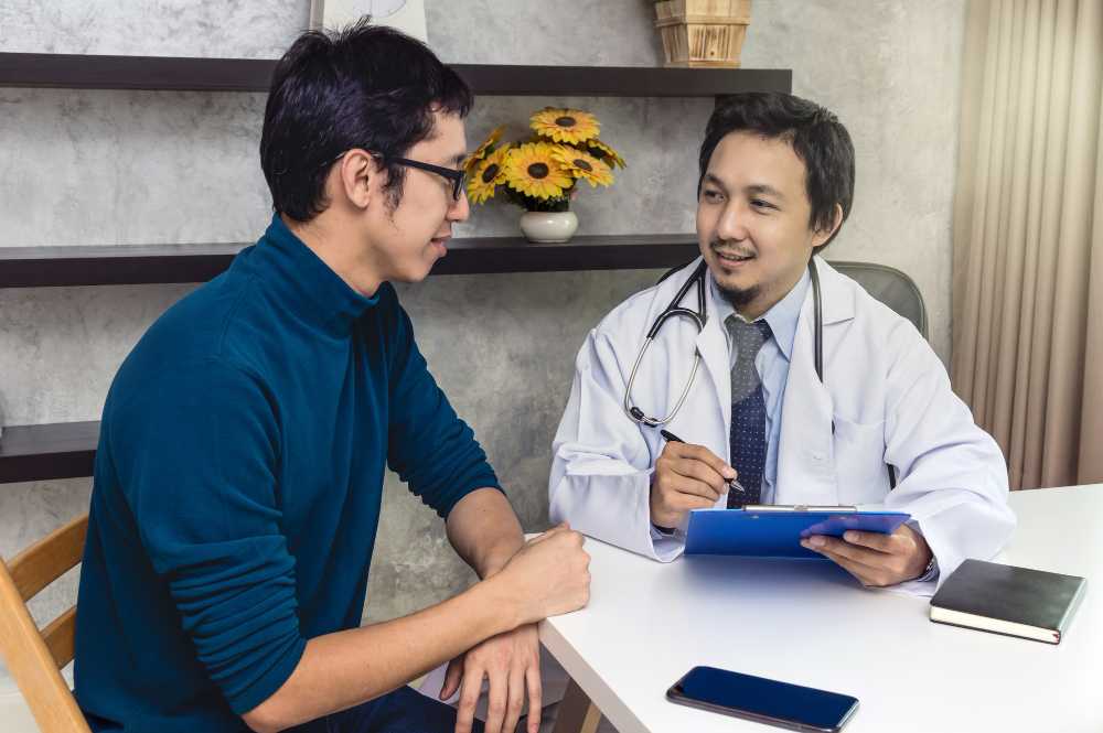 A doctor taking notes of a patient